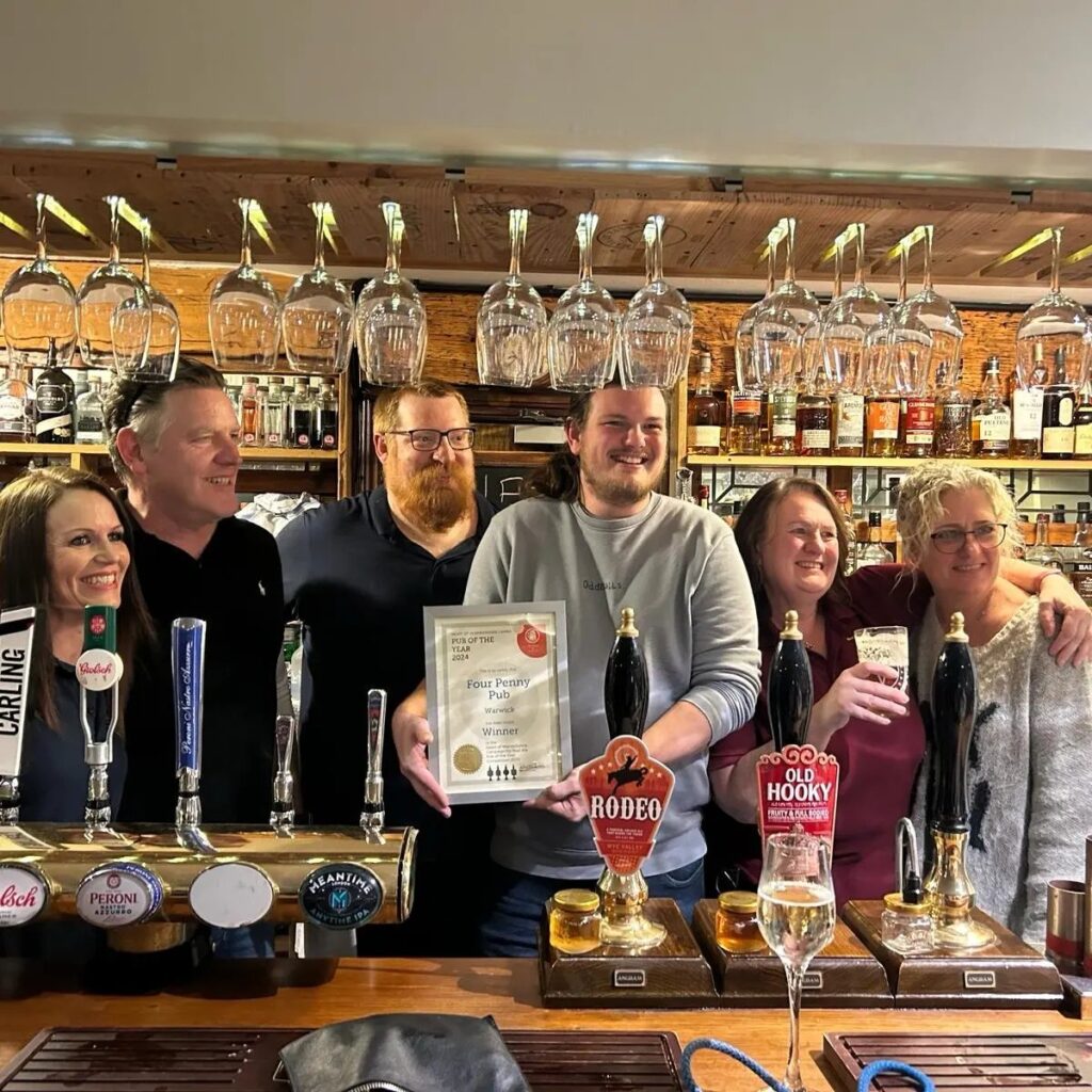 happy four penny team with camra award